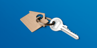 Key with house-shaped keychain